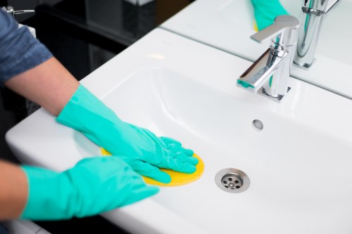 Local carpet cleaner treating stains in a Wimbledon living room